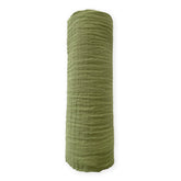 SwaddleDesigns cotton muslin swaddle blanket with green turtle motif for breathable comfort.