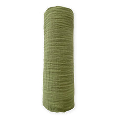 SwaddleDesigns cotton muslin swaddle blanket with green turtle motif for breathable comfort.