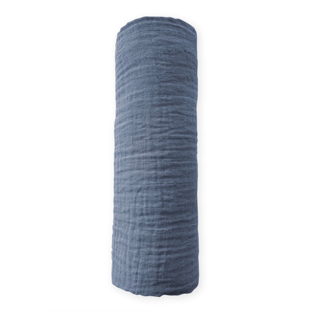 SwaddleDesigns denim muslin swaddle blanket folded; durable and machine washable.