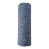 SwaddleDesigns denim muslin swaddle blanket folded; durable and machine washable.