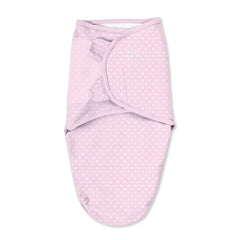 SwaddleMe: small pink polka whale, closure close-up showing secure hook-and-loop fit.