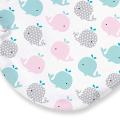 SwaddleMe Original Swaddle small pink polka whale wrapped softly around baby.