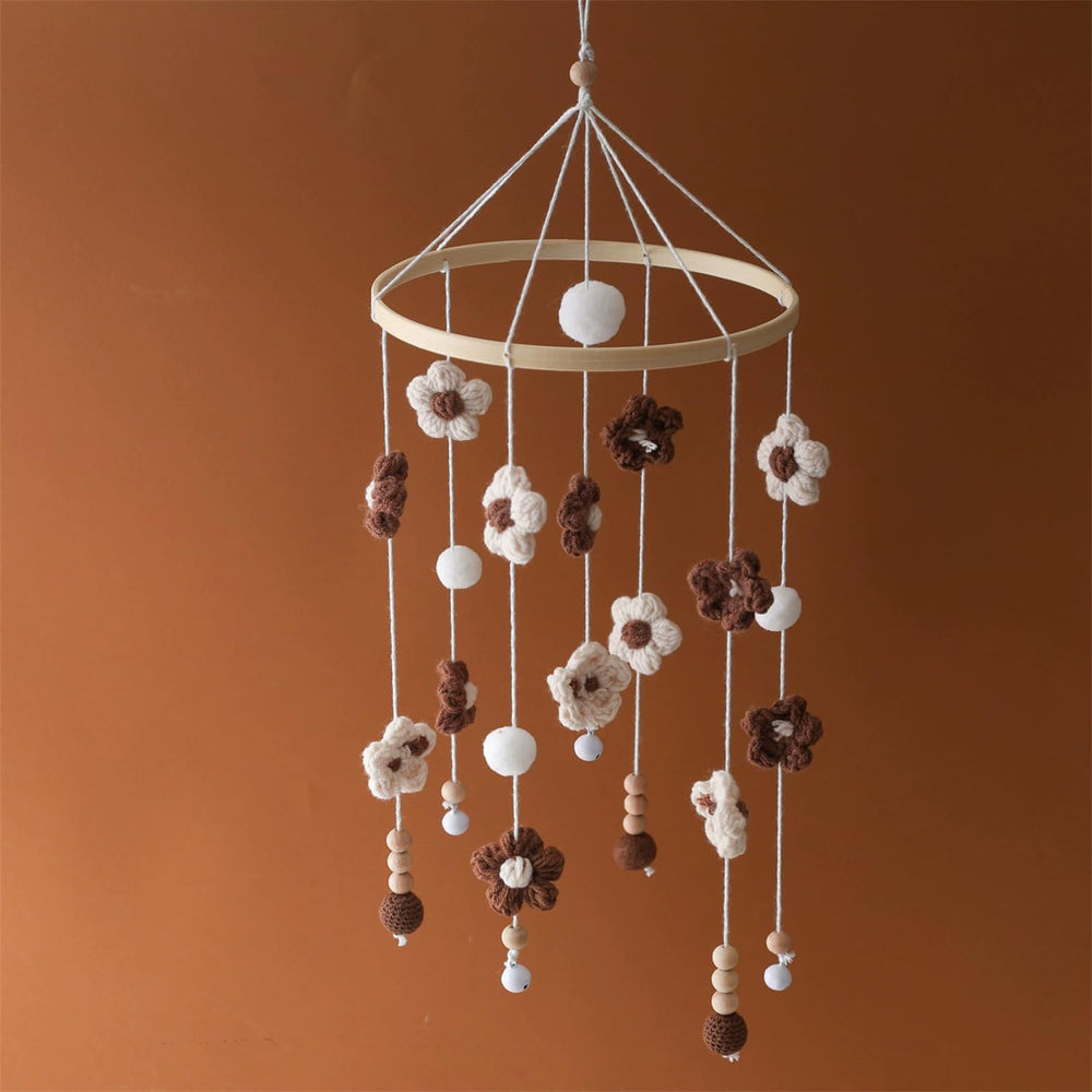 SWECOMZE baby mobile with colorful flowers gently rotates to soothe infant.