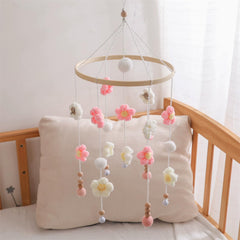 SWECOMZE hand-crocheted flowers include tiny bells for soft auditory interest.