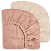 Sweet Dolphin 2-pack crib sheets folded neatly for backups.