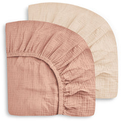 Sweet Dolphin 2-pack crib sheets folded neatly for backups.
