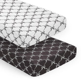 Sweet Jojo Designs crib sheets with a snug fit and bows create a calm nursery.