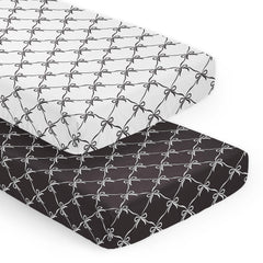 Sweet Jojo Designs crib sheets with a snug fit and bows create a calm nursery.