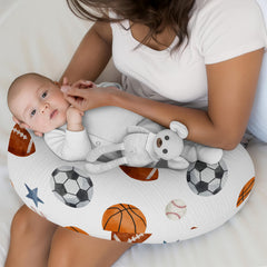 Sports-ball pattern on breathable cotton muslin for gentle baby skin.