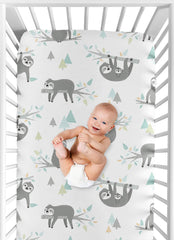 Sweet Jojo Designs turquoise-green jungle print sheet adds vibrant style to the nursery.