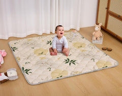 TADO MUSLIN baby play mat with whale print, side view showing secure backing