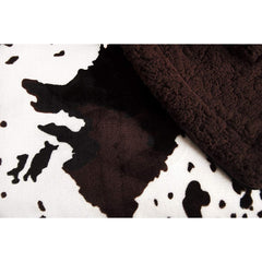 Tadpoles plush sherpa cowhide blanket in stroller for on-the-go warmth