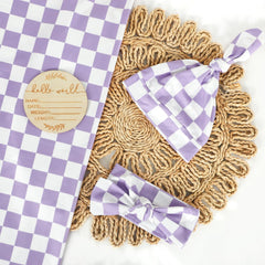 Tanofar matching purple headband complements the swaddle set.