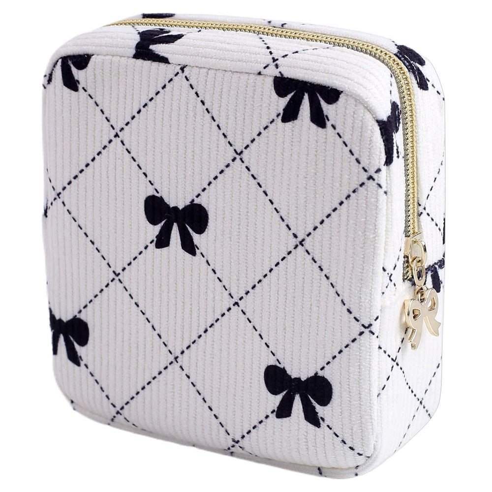 Teircno period bag in corduroy with bow for discreet daily carry and organization.
