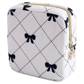 Teircno period bag in corduroy with bow for discreet daily carry and organization.