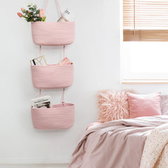TeoKJ pink decorative hanging baskets brighten nursery decor.
