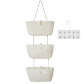 TeoKJ over-the-door cotton baskets with wooden button detail keep nursery items organized.