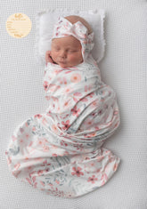 Terriboo newborn floral blanket close-up shows soft stretch fabric for delicate skin.