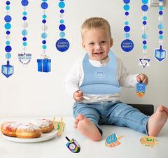 The Dreidel Company spill pocket bib catching spills at meals