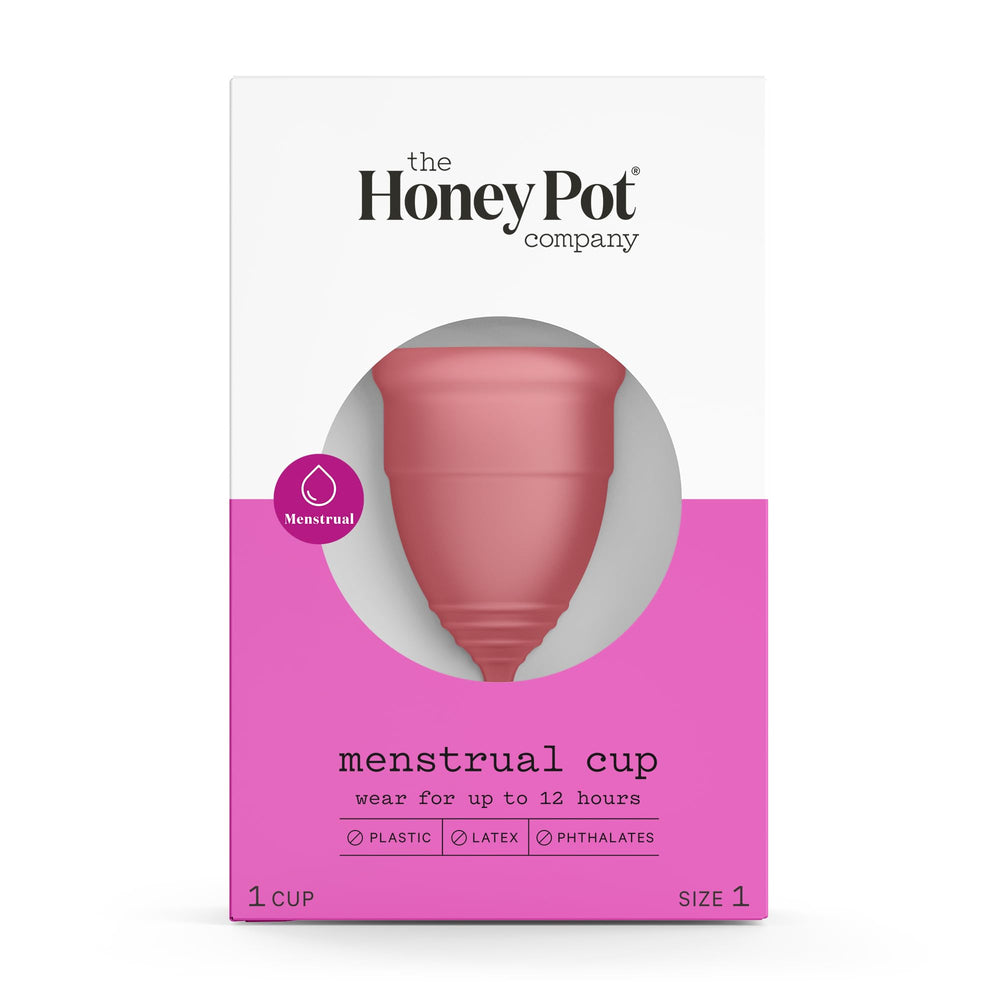 The Honey Pot menstrual cup Size 1 held in hand, soft silicone for reusable protection.