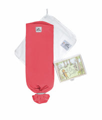 The Ollie Swaddle arms-in-out usage demonstrates flexible sleep options for newborns.