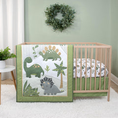 The Peanutshell Dinosaur Dreams crib quilt adds cozy, playful nursery decor