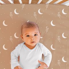 The Peanutshell dust ruffle completes the look with a soft, coordinated finish.