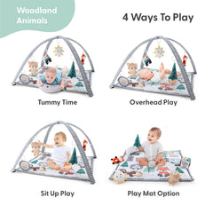 The Peanutshell woodland play gym with bear for reach and grasp play.