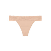 Thinx For All Leaks beige thong underwear worn on model for everyday comfort