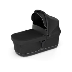 Thule bassinet with extended canopy offering sun protection and comfort