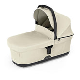 Thule Bassinet Soft Beige attached to stroller for quick, secure attachment on the go.
