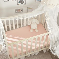 TILLYOU mini crib sheet showing 38x24 inch mattress fit for secure bedding