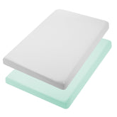 TILLYOU mini crib fitted sheet in light green wrapped snugly for a secure fit.