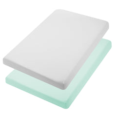 TILLYOU mini crib fitted sheet in light green wrapped snugly for a secure fit.