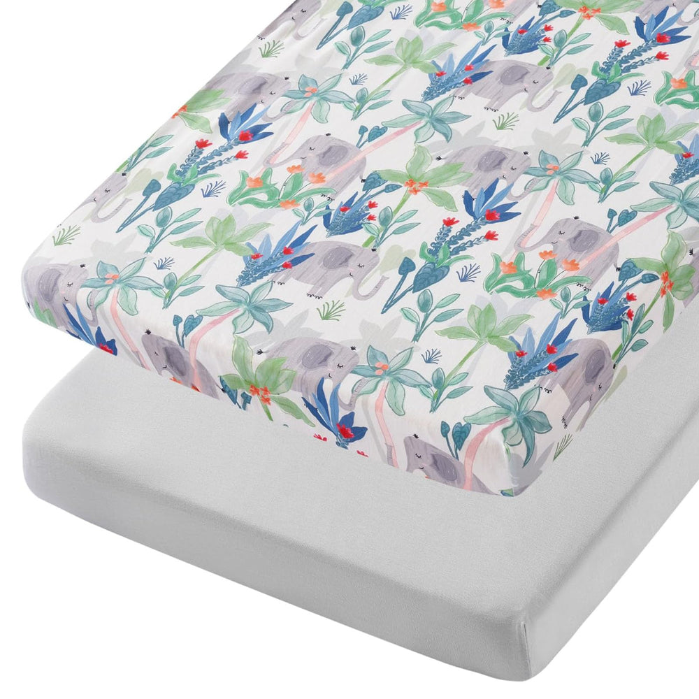 TILLYOU mini crib sheets in Rainforest Elephant pattern fit snugly to stay in place.