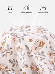 TILLYOU muslin crib sheets yellow flower on mattress showing secure fit with elastic edge.