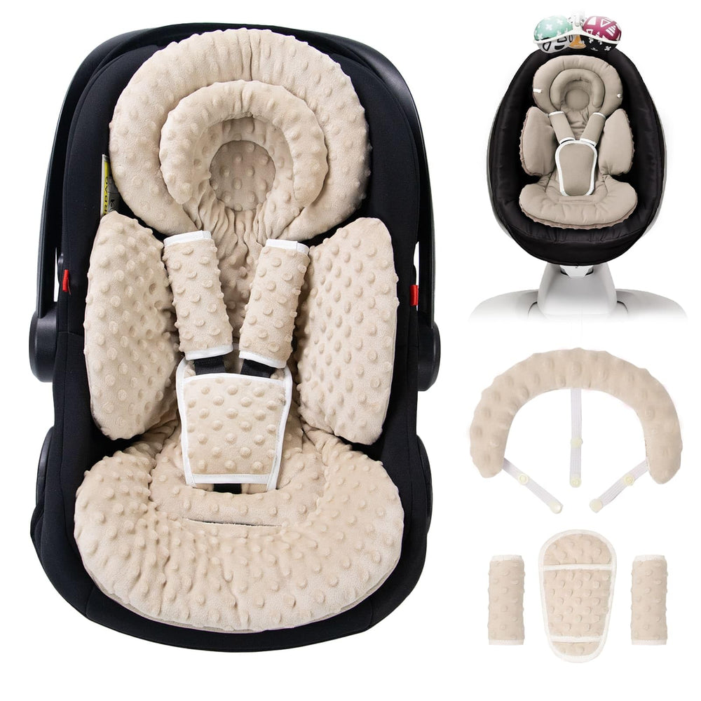 TinlyFinly infant seat insert with dots beige provides cozy head support during car rides.