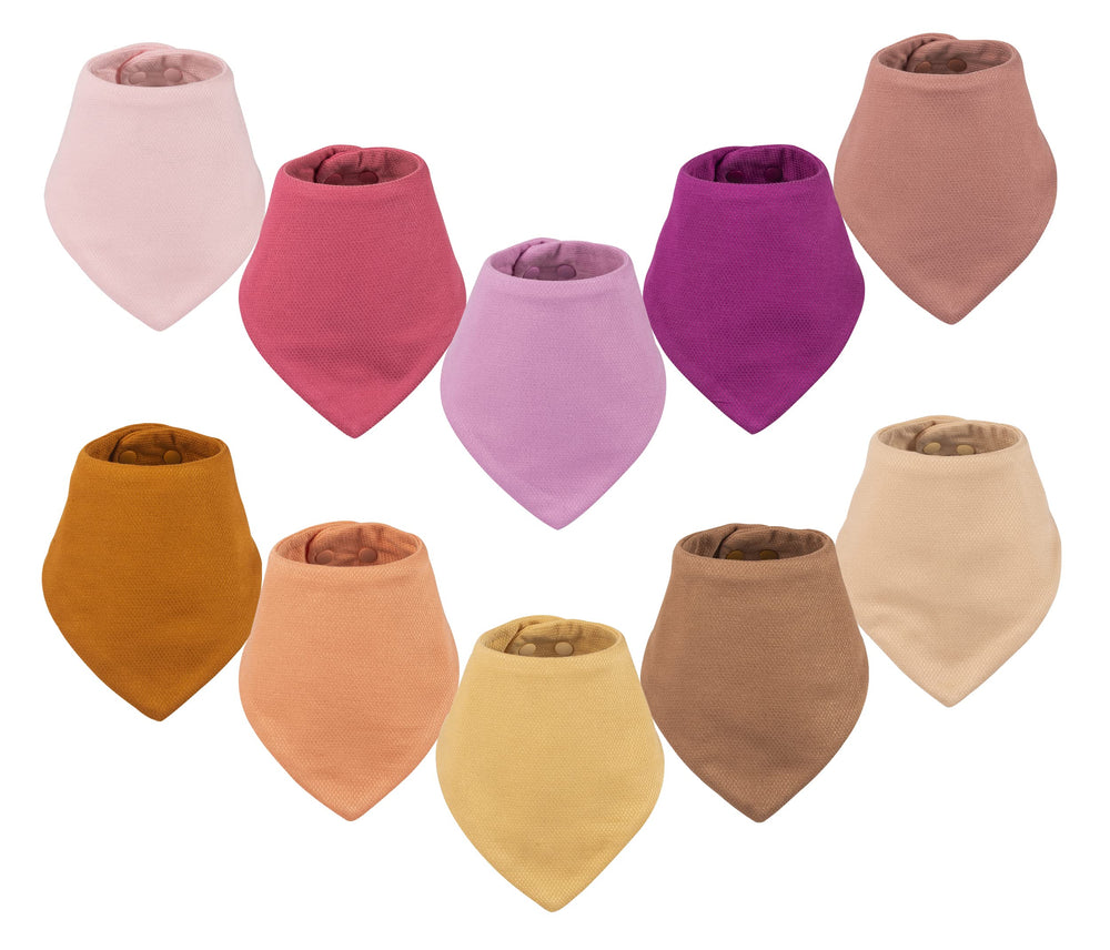 Tiny Twinkle Bandana Bibs on display with water-resistant outer layer and absorbent core.
