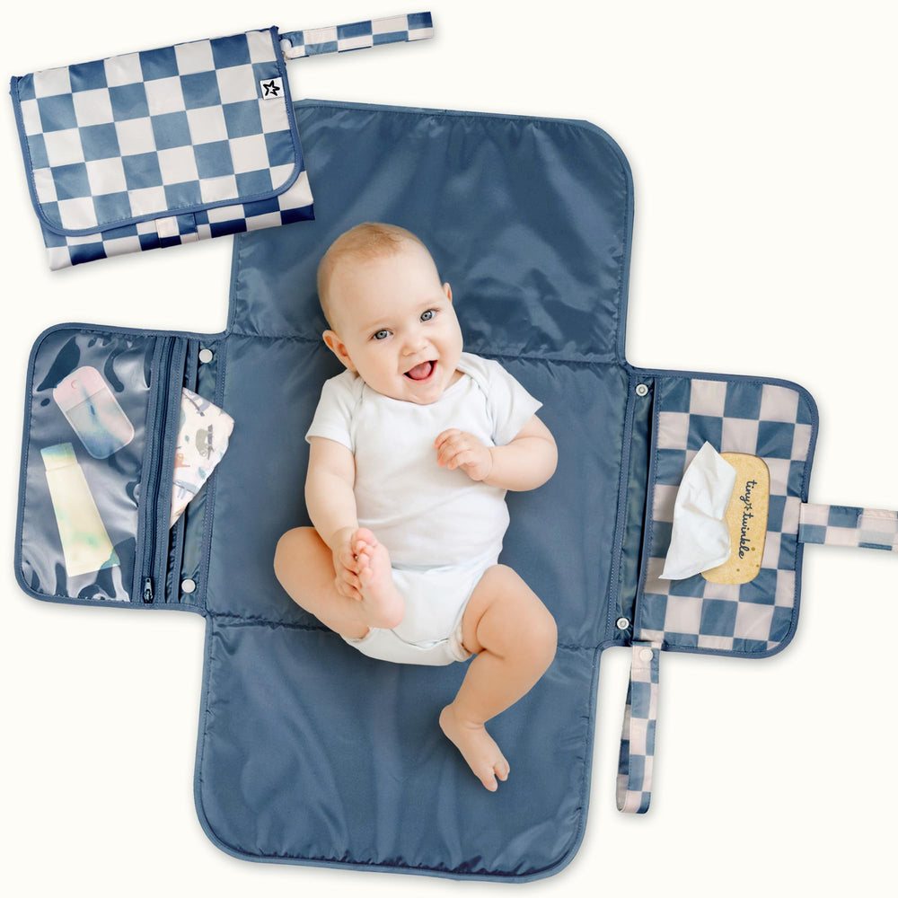 Tiny Twinkle changing pad folded to 7x10 inches for easy storage.