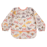 Tiny Twinkle long sleeve bib during mealtime scene keeps outfits clean