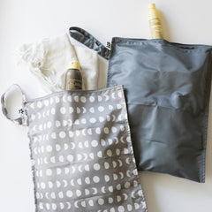 Tiny Twinkle Mess Proof Wet Bag gray shows diaper capacity for busy days.