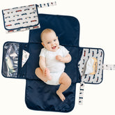 Tiny Twinkle portable changing pad in compact fold design for easy storage on the go.