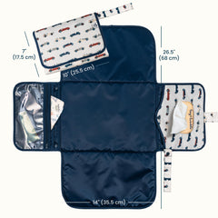 Tiny Twinkle changing pad waterproof surface keeps messes contained during changes.