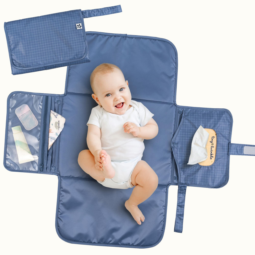 Tiny Twinkle portable diaper changing pad with waterproof surface for mess-free changes.