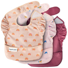Tiny Twinkle unicorn bib with catch pocket keeps crumbs off clothes during meals.