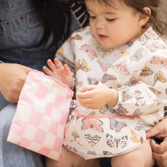 Tiny Twinkle waterproof smock bib closeup showing easy-clean surface