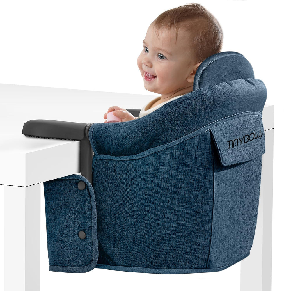 Tinybow hook-on high chair securely attached to a table with a sturdy clamp