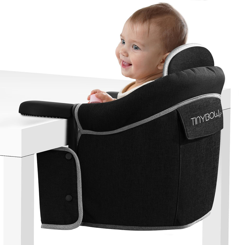 Tinybow hook-on high chair attached to table for safe baby meals.