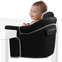 Tinybow hook-on high chair attached to table for safe baby meals.