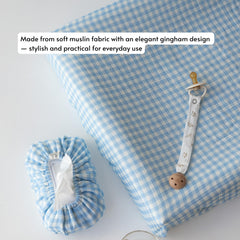 TISU changing table accessory with elastic edge for quick, secure fitting.
